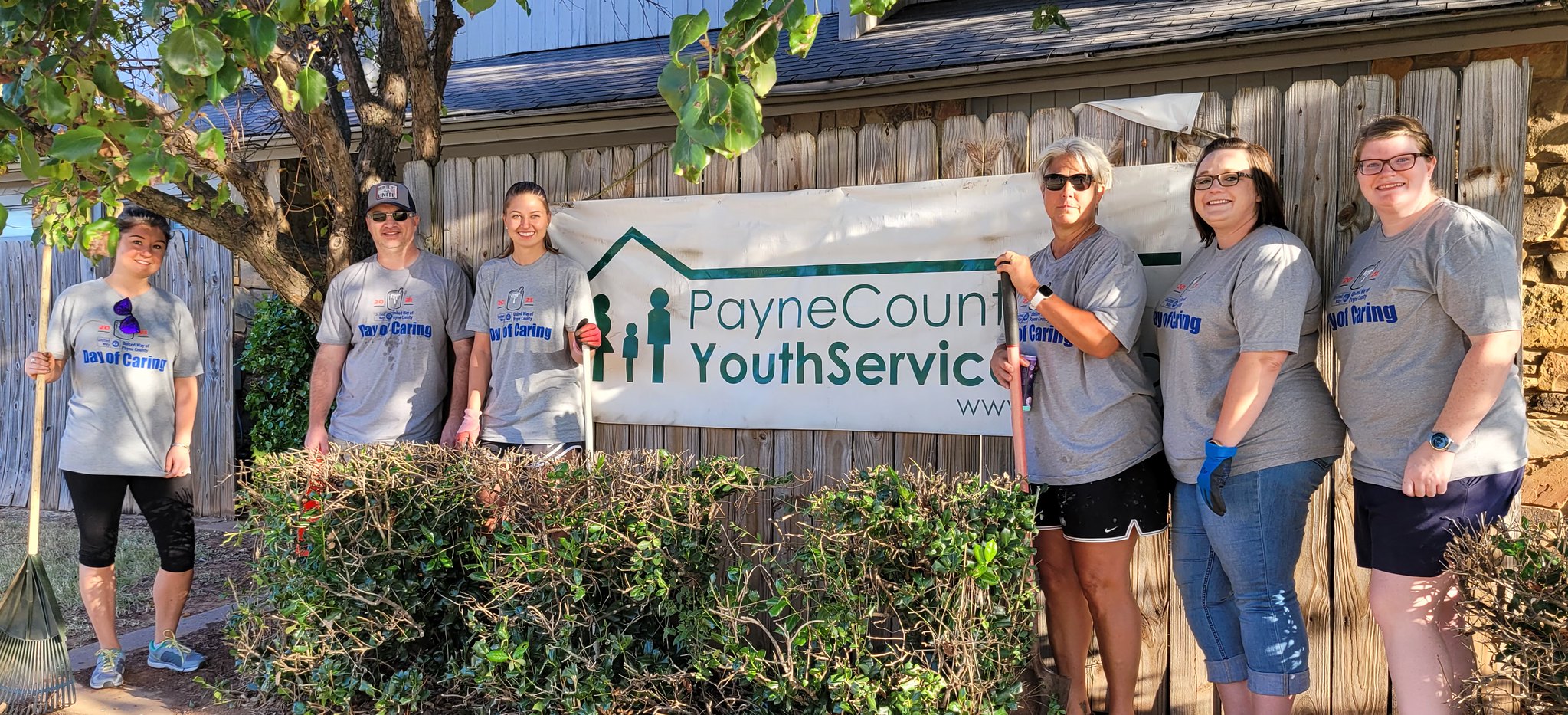 Volunteers for BancFirst & OSU Alumni Association help out at the office of Payne County Youth Services. 