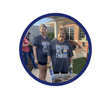 Two women wearing Day of Caring t-shirts