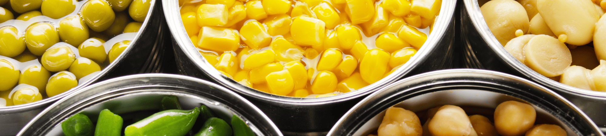 Cans of corn, green beans, chickpeas and peas
